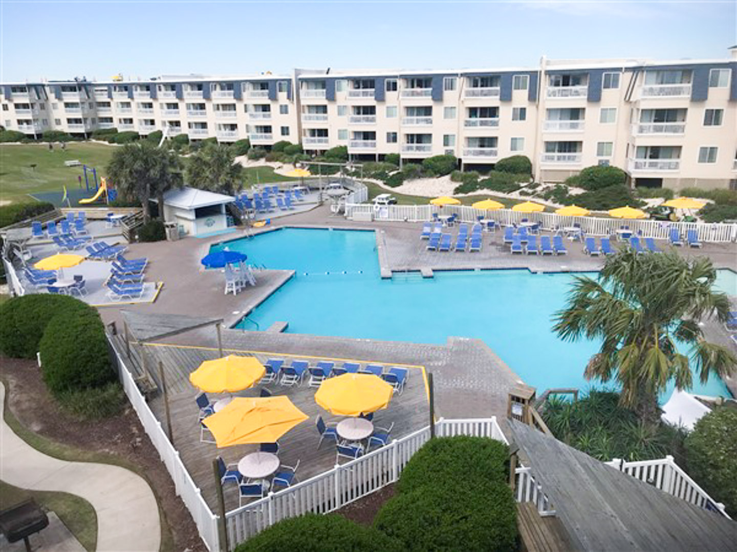 A spacious outdoor swimming pool at VRI's A Place at the Beach in Atlantic Beach, NC.
